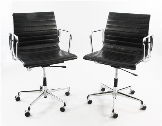 A pair of Vitra Charles Eames EA117 aluminium desk chairs,